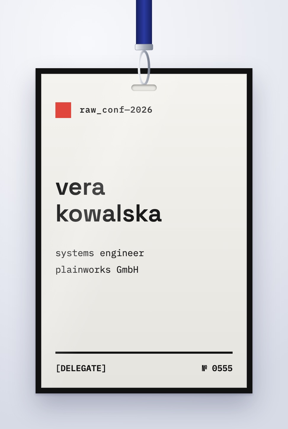Brutalist event badge design with a heavy black border and monospace type, on a lanyard